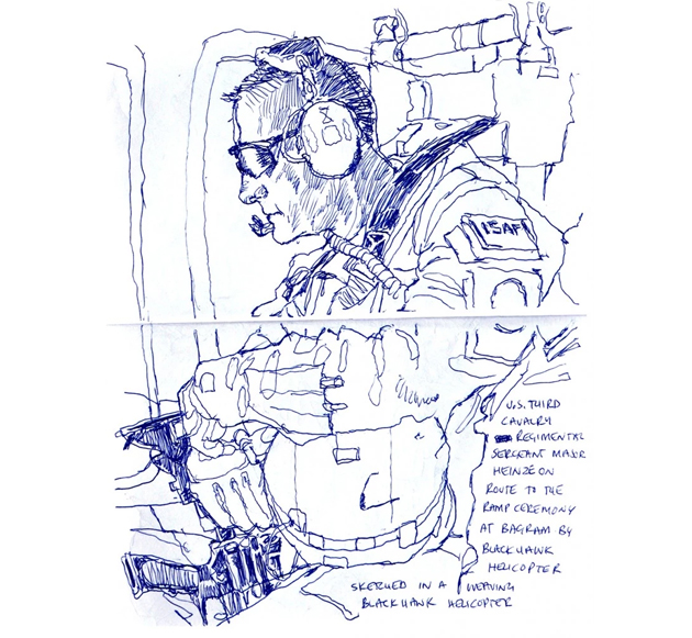 Regimental Command Sgt. Maj. Roger Heinze of Texas is shown on a chopper flight in Afghanistan, heading from Forward Operating Base Lightning to a ramp ceremony at Bagram Airfield to honor a fallen soldier.