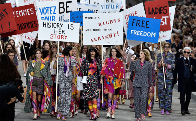 Karl Lagerfeld turns the Chanel catwalk into a (stylish) feminist demonstration.