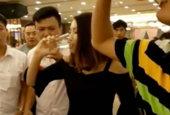 Pressured to down hard liquor by men, bridesmaid chokes to death in China