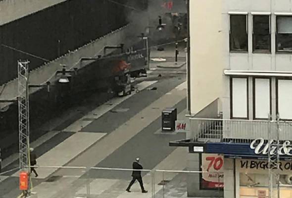 Three killed as truck drives into crowd in Swedish capital Stockholm