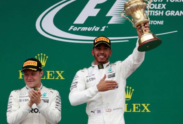 British GP: Four in a row for Hamilton as blowout hits Vettel