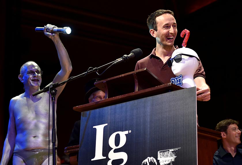 Marc-Antoine Fardin accepts the Ig Nobel prize for Physics for his study, 