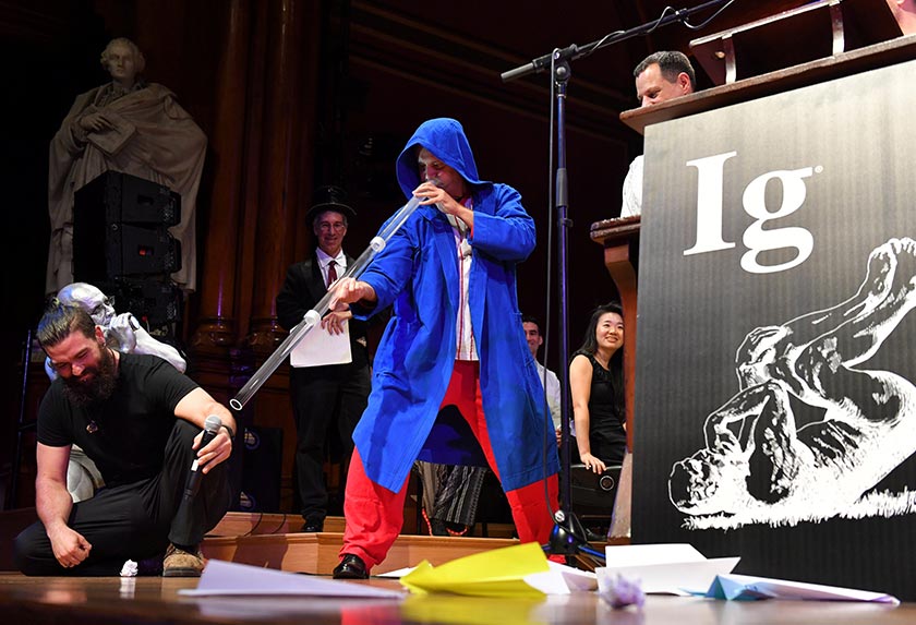 Didgeridoo instructor Alex Suarez, center, demonstrates the Ig Nobel Peace prize-winning study, 