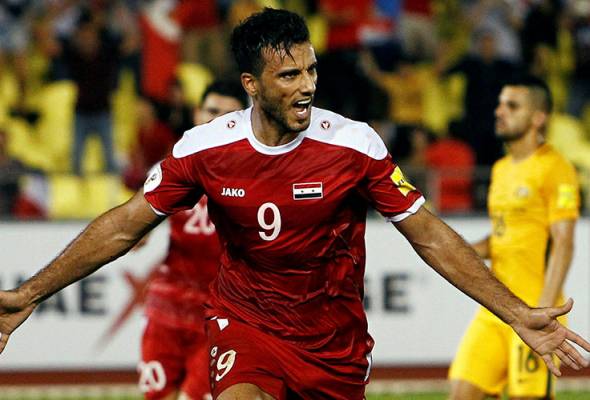 Late penalty keeps Syria's World Cup dream alive