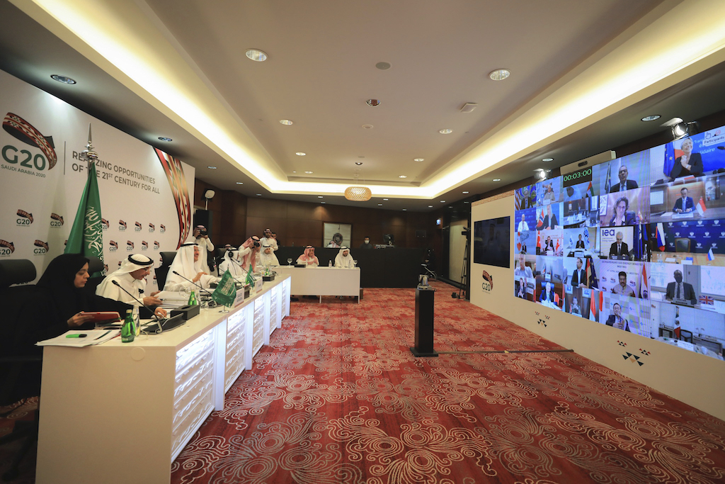 In this photo released by Saudi Energy Ministry, Prince Abdulaziz bin Salman Al-Saud, Minister of Energy of Saudi Arabia, third right, chairs a virtual summit of the Group of 20 energy ministers at his office in Riyadh, Saudi Arabia, Friday, April 10, 2020, to coordinate a response to plummeting oil prices due to an oversupply in the market and a downturn in global demand due to the pandemic. (Saudi Energy Ministry via AP)