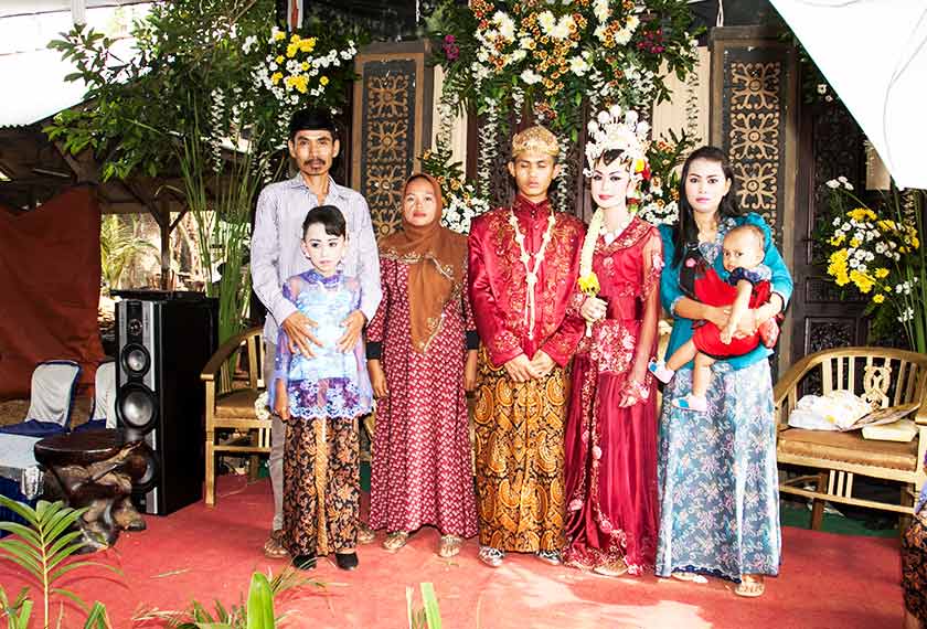 Pak Tukin with his family members at the wedding reception of his daughter. - Karim Raslan Photo