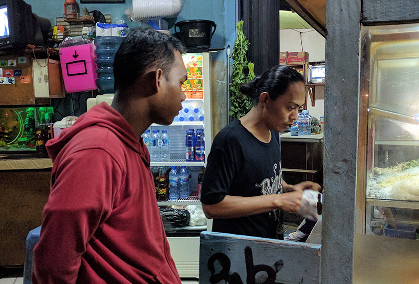 Fiki, 18, a frequent customer of Pak Udin, works as security personnel at Hotel Indonesia. - Karim Raslan Photo