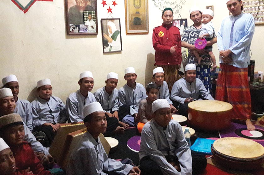 Ahmad's house has become a centre for kids in the neighbourhood to recite the Quran and practice hadroh every day. - Karim Raslan Photo