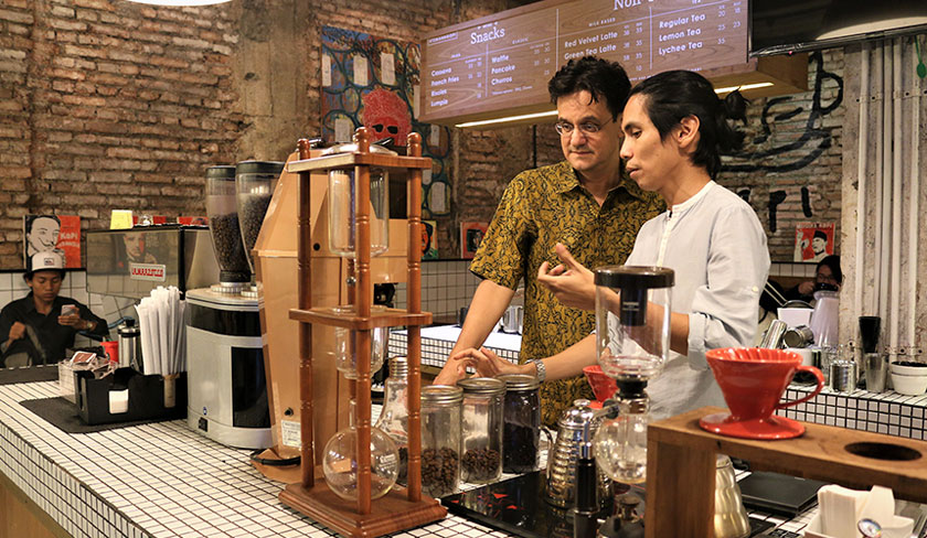 Angga Sasongko in addition to being a director of a coffee-themed film, is also good at making coffee at his shop in the Blok M Jakarta area. Karim Raslan Photo