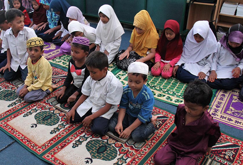 Children at the Darul Eslah Academy learn about the pillars of Islam, including prayers. Karim Raslan Photo