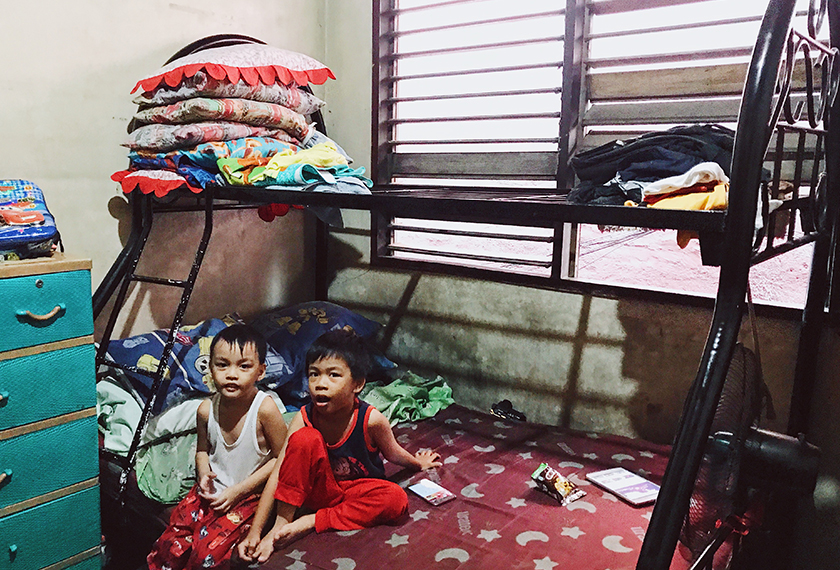 The family share two bedrooms, making do with four bunk beds and some mattresses on the floor. Karim Raslan Photo