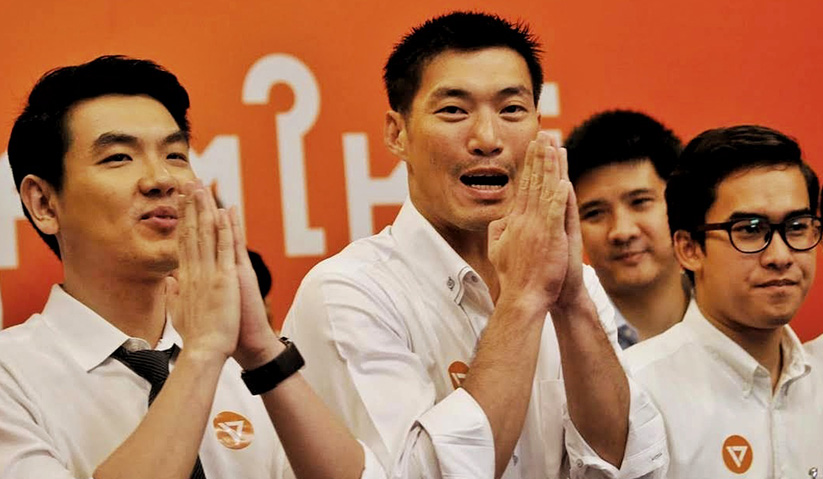 Thanathorn (centre) was charged in late August for alleged slanderous remarks against the military junta in a Facebook post. Associated Press Photo