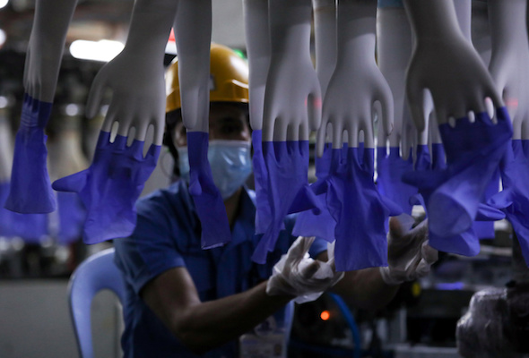 Malaysia charges Top Glove over poor quality of worker housing