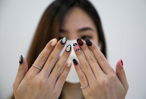 Malaysian salon paints Squid Game manicures of tiny coffins, green tracksuits