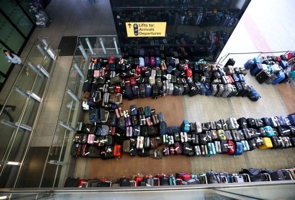 Luggage piles join long airport lines in fresh woes for summer travel