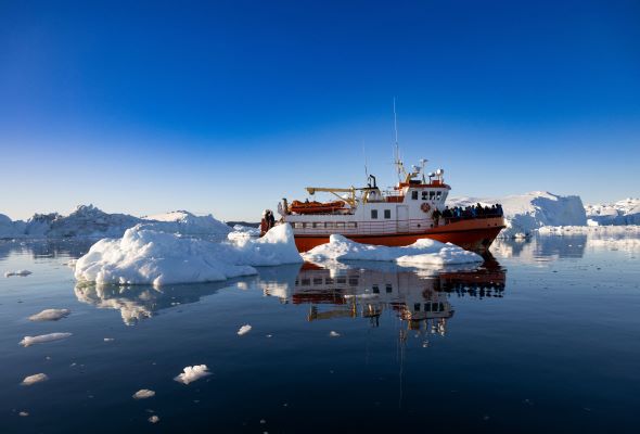 Greenland treads softly on tourism as icebergs melt