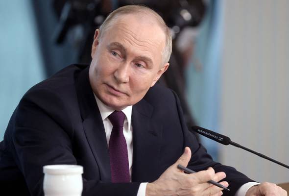 Putin denies he tried to frighten Merkel with dog Koni