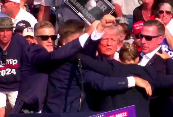 Trump shot in right ear at rally, source says shooter dead