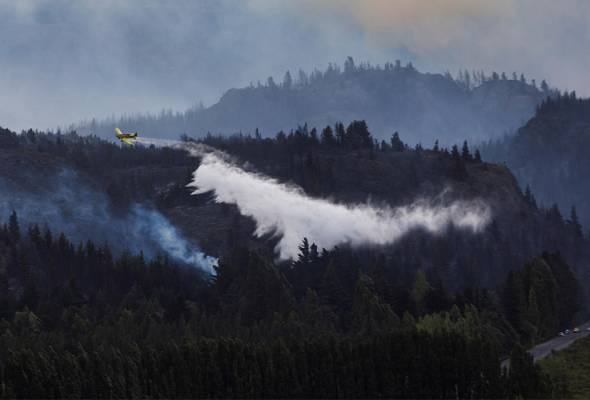 Los Angeles wildfires rage as strong winds put millions on alert