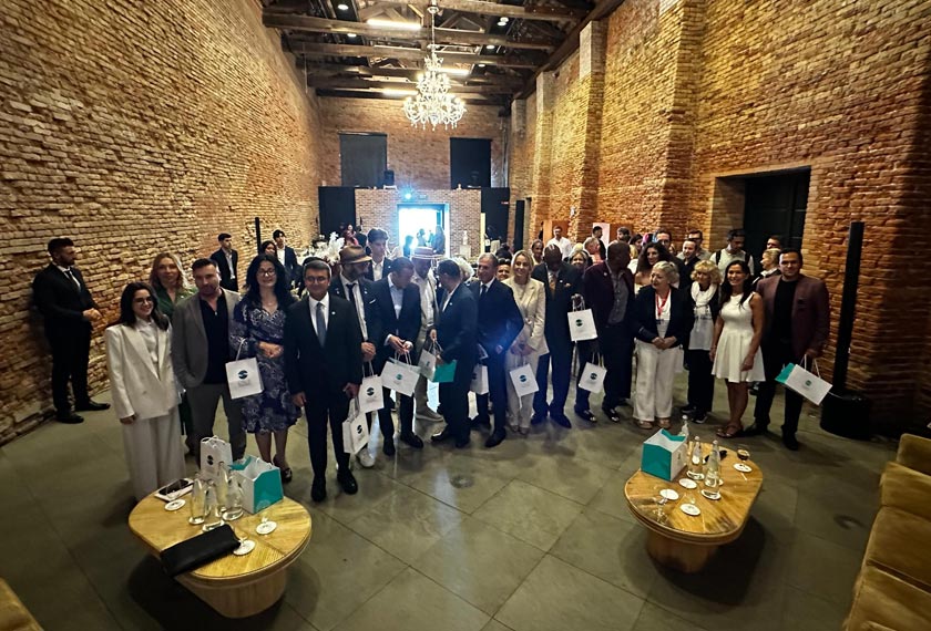 People posing for a picture at the forum